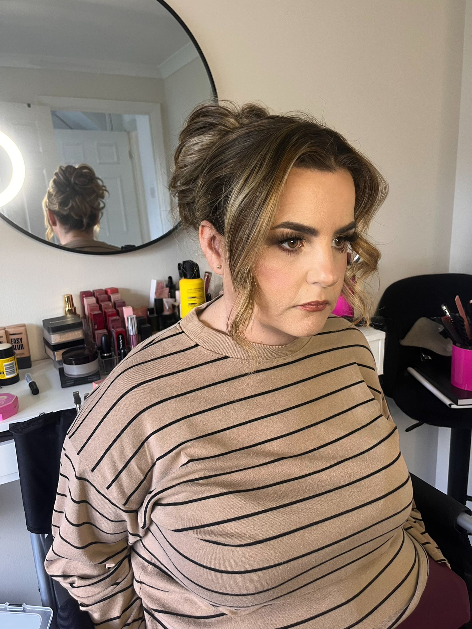 Side view of occasion hair styling and makeup